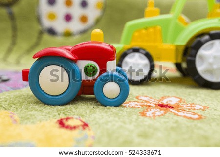 Colorful tractors on a colorful background
