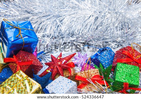 Christmas decoration with gifts and star on wooden background