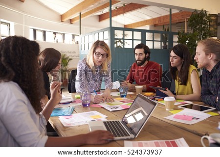 Female Manager Leads Brainstorming Meeting In Design Office Royalty-Free Stock Photo #524373937