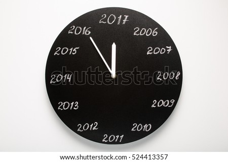 Concept of clock on the eve of 2017. White background.
