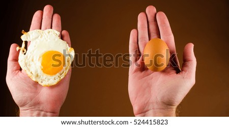 fried egg and raw in hand