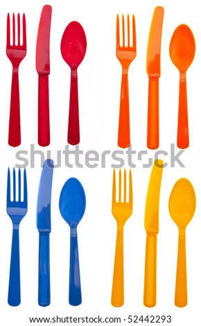 Four Sets of Vibrant Plastic Forks, Knives and Spoons in Red, Orange, Yellow and Blue.  Isolated on White with a Clipping Path. Royalty-Free Stock Photo #52442293