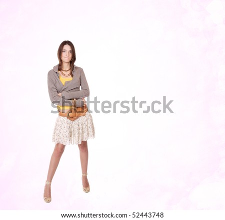Portrait of young cute girl on pink studio background