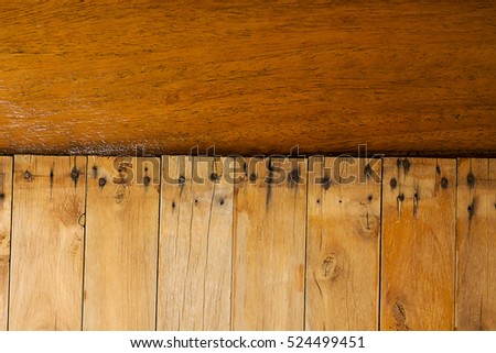 Old wooden brown grain texture, dark wall background, top view