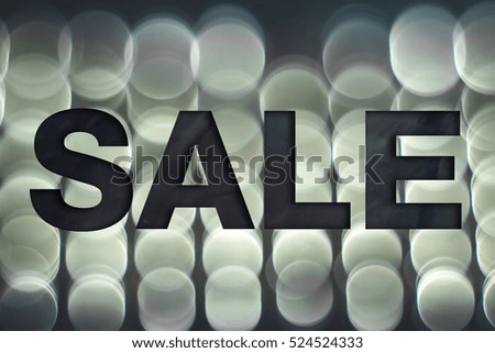 Sale poster. Material-style bold lettering on blurry abstract background
