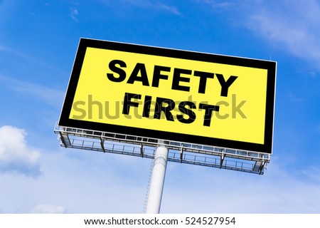Safety First sign billboard and clouds blue sky background