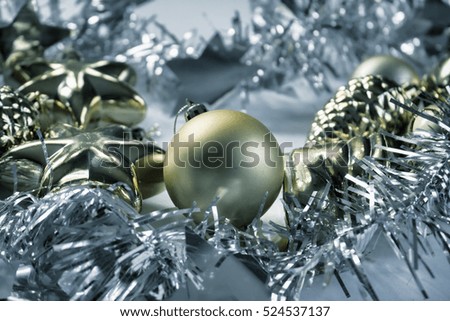 Vintage Christmas ornament background. Christmas tree silver ribbon. Gold fir tree ball. Festive winter holiday composition. Christmas greeting card template. Silver and gold decor toned photo