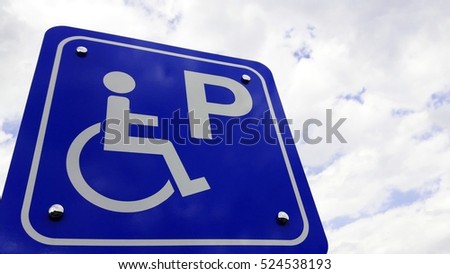 parking road sign with a wheelchair sky background.
