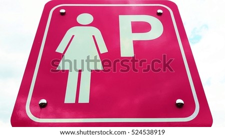 Lady parking sign on blue sky background.