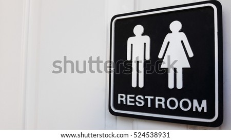 Restroom sign on a toilet door,on white background.