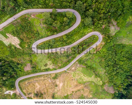 Aerial view of crooked path of road on the mountain, Shot from drone