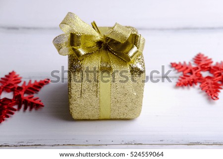 Close up of Merry christmas and Happy new year with gift box concept on white wooden background. Blank space, selective focus and decorated style.