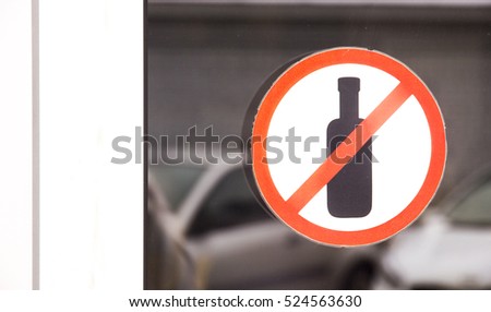 Prohibiting sign on the glass door to the coffee shop no alcohol