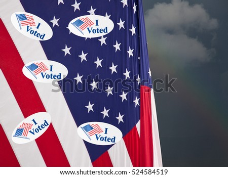 Multiple I Voted stickers with USA flag on stormy background illustrating potential voter fraud with illegal votes and need for recount