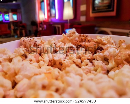 Eat popcorn when you watch movie at the theater Royalty-Free Stock Photo #524599450