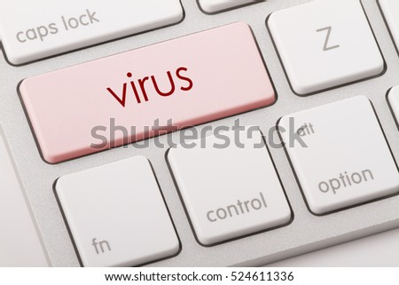 Virus word written on computer keyboard.   