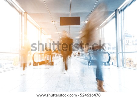 Blurred business people at a congress corridor