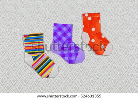 set of cute origami Christmas stocking or socks with color ornament. Merry Christmas greeting card 

