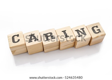 CARING word made with building blocks isolated on white