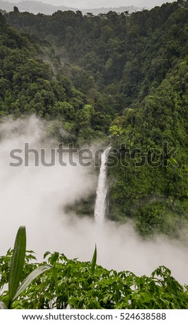 Nature landscape of waterfall in Laos.waterfall in mountain forest under great sky.Adventures and travel concept.Scenic landscape.beautiful place.wild nature.