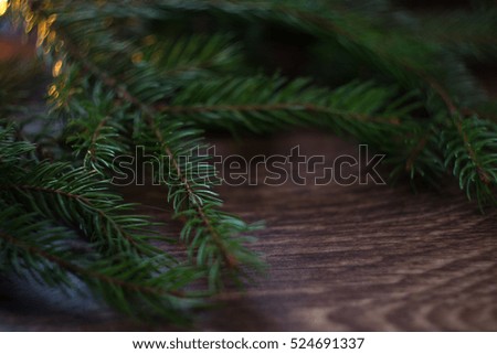 Christmas-tree branch on a wooden background