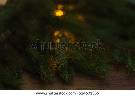Christmas-tree branch on a wooden background