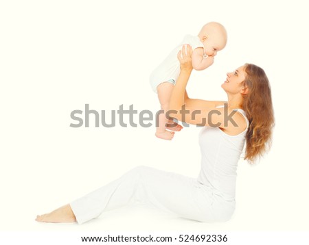 Happy mother playing with her baby on a white background