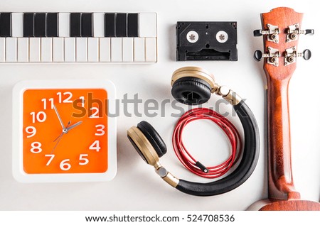 Music Entertainment time. Music equipments with wall clock timing.