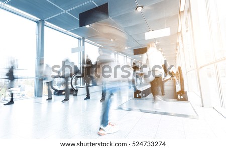blurred people walking in a modern hall entrance 