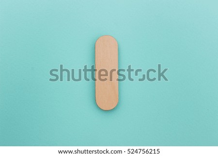 English alphabet made of wood are isolated on a blue background. Latin.