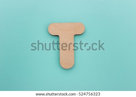 English alphabet made of wood are isolated on a blue background. Latin.