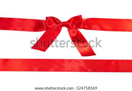 Red horizontal gift ribbons and luxurious bow isolated on white background 