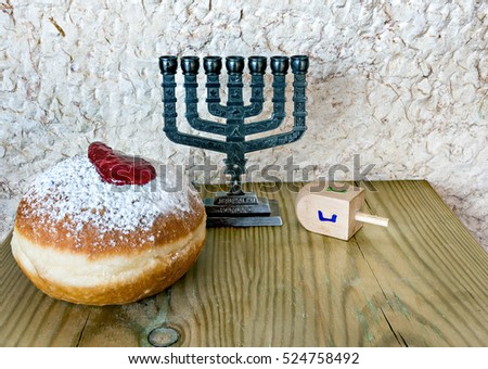 Traditional Jewish attributes and symbols for Hanukkah holiday. Selective focus. Image toned for inspiration of retro style and solemn evening ceremony