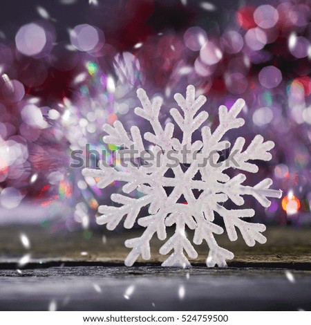 snowflakes on a wooden background.