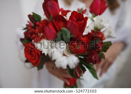 Wedding bouquet . The bride's bouquet. Bouquet of red and pink flowers, black berries and greener