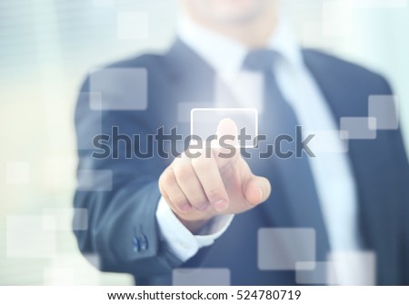 business man pressing a touchscreen button Royalty-Free Stock Photo #524780719