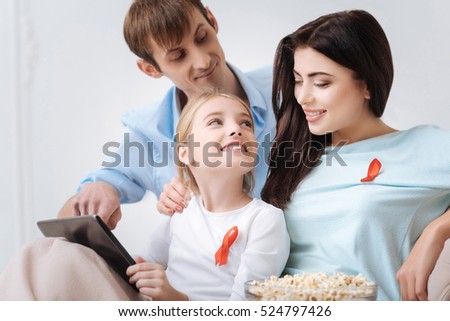 Attractive beautiful woman looking at her daughter