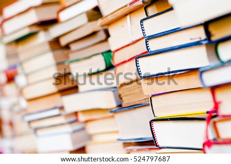 Stack of books background. many books piles. Royalty-Free Stock Photo #524797687