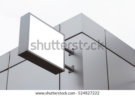 Horizontal front view of empty square white signage on a building with modern metallic plates 