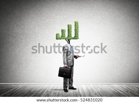 Faceless businessman with green graph instead of head
