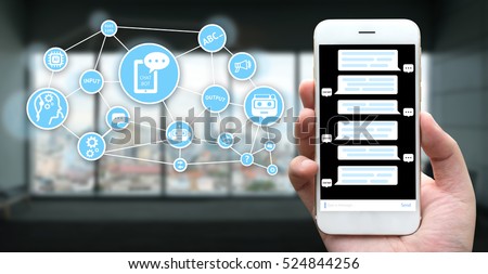 Chat bot and future marketing concept. Hand holding mobile phone , Chatbot application and infographic with building and window background