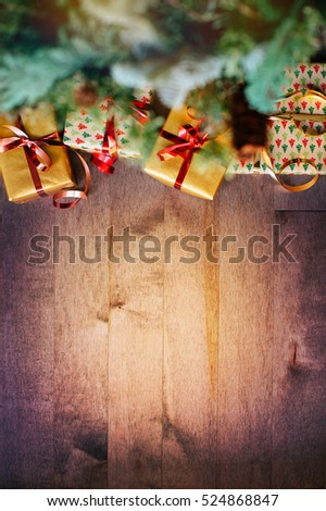 Vertical picture of a wooden board and gift boxes, Holidays background, Christmas background with decorations and gift boxes on wooden boar, Film effect 