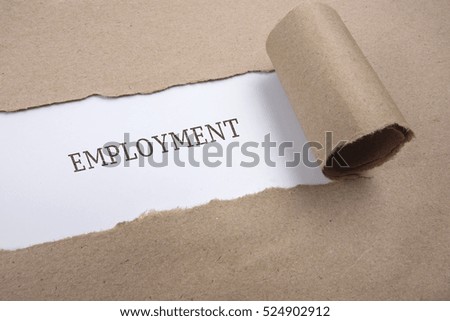 Torn brown paper on white surface with "employment" word.