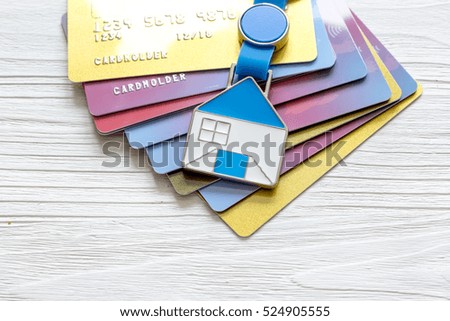 credit cards concept mortgag for new home on wooden background