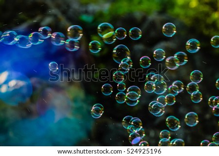 blurred natural background with soap bubbles