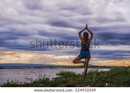 yoga woman meditate on sunset beach

