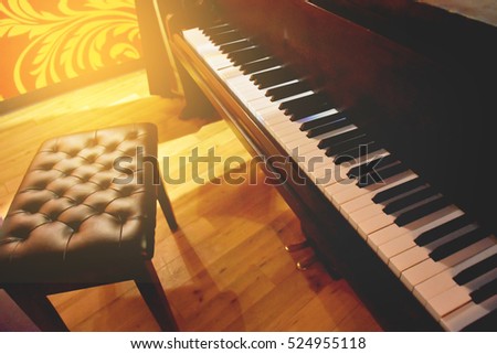 Piano keyboard and stool chair with flare light,music concept
