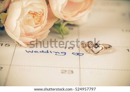 Wedding note on a calendar sets a reminder for the wedding day Royalty-Free Stock Photo #524957797