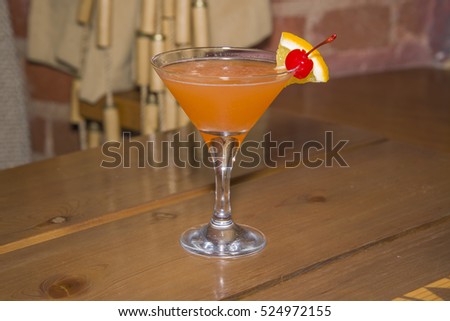 Orange cocktail in a glass at one of the capital's bars.