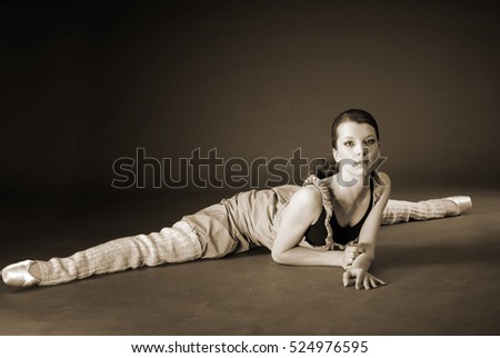 young ballerina in a black leotard